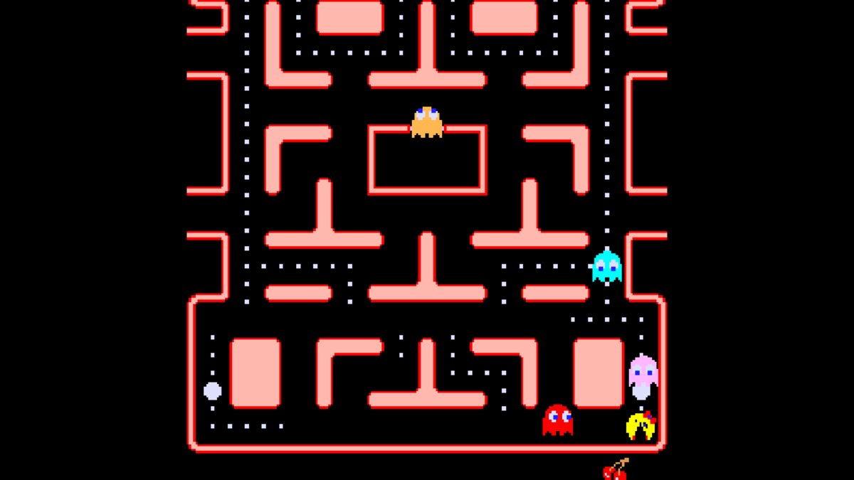 Ms. Pac-Man in her first pink maze with Blinky, Pinky and Inky closing in and Sue in the ghost house