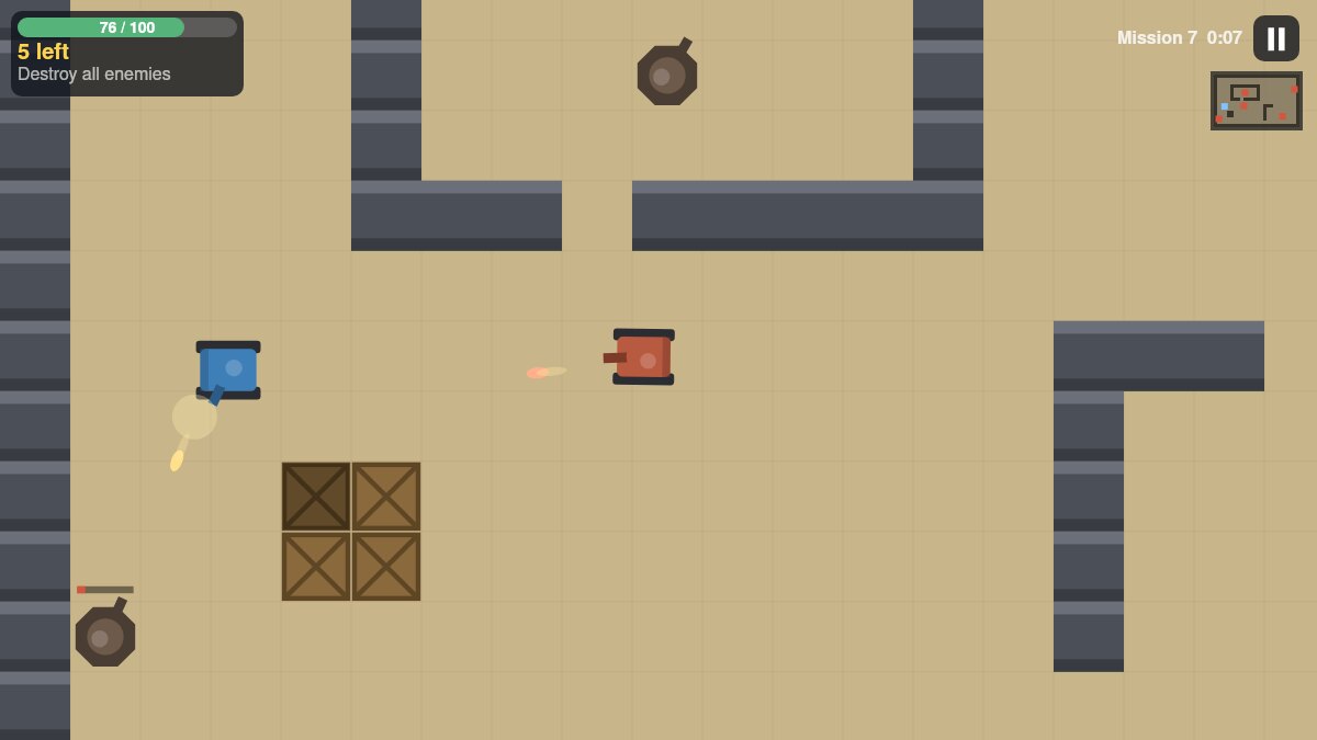Tank Battle Arena mission 7: a blue player tank fires at a red enemy tank while two gun turrets cover the arena between walls and wooden crates